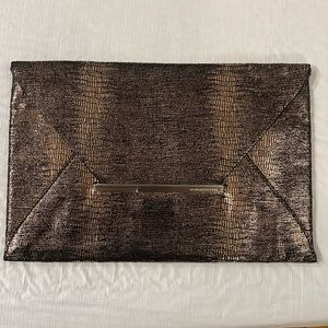 BCBG copper snake skin clutch